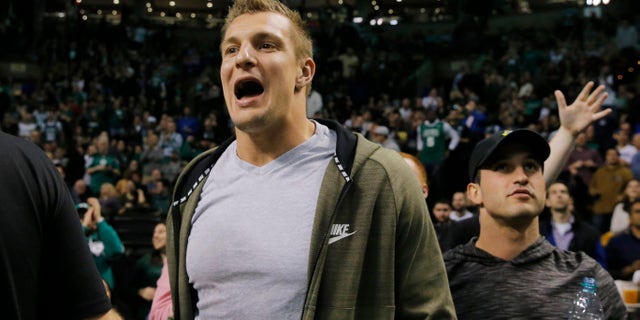 Rob Gronkowski reacts after a basket by the Boston Celtics during the game against the LA Clippers in the second quarter at TD Garden.