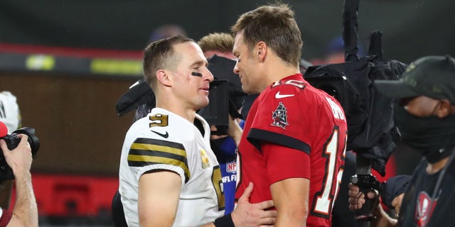 New Orleans Saints quarterback Drew Brees (9) and Tampa Bay Buccaneers quarterback Tom Brady (12) greet each other after the game at Raymond James Stadium.