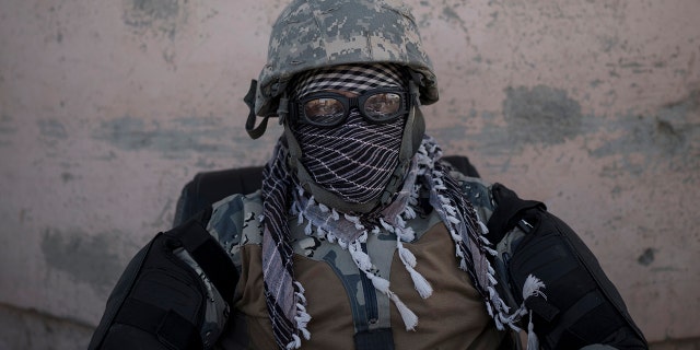 A Taliban fighter guards the entrance to Pul-e-Charkhi prison in Kabul, Afghanistan, Monday, Sept. 13, 2021. (AP Photo/Felipe Dana)