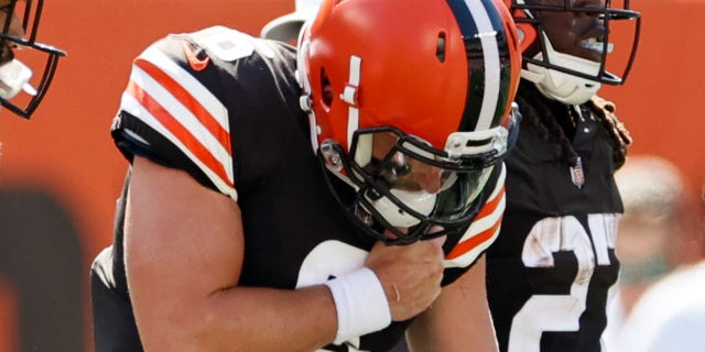 Cleveland Browns quarterback Baker Mayfield holds his shoulder after getting hurt during the first half of an NFL football game against the Houston Texans, Sunday, Sept. 19, 2021, in Cleveland.