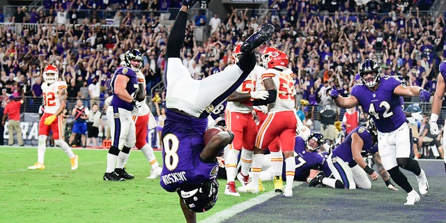Baltimore Ravens quarterback Lamar Jackson (8) flips into the end zone for  a fourth quarter touchdown  against the Kansas City Chiefs at M&amp;T Bank Stadium. 