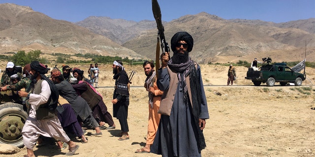 Taliban soldiers stand guard in Panjshir province northeastern of Afghanistan, Wednesday, Sept. 8, 2021. 