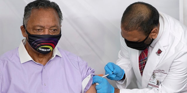 The Rev. Jesse Jackson receives the Pfizer-BioNTech COVID-19 vaccine from Dr. Kiran Chekka, Covid administration physician, at the Roseland Community Hospital in Chicago. (Associated Press)