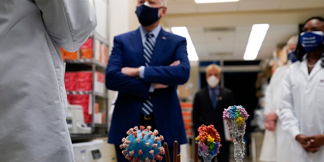 In this Feb. 11, 2021 file photo, President Joe Biden visits the Viral Pathogenesis Laboratory at the National Institutes of Health (NIH) in Bethesda, Md.