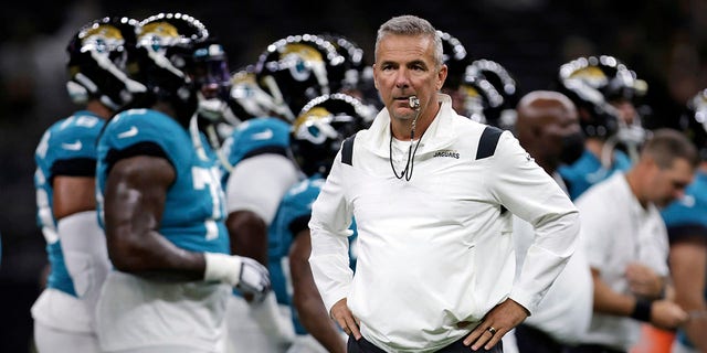 Jacksonville Jaguars head coach Urban Meyer watches as his team warms on Aug. 23, 2021.