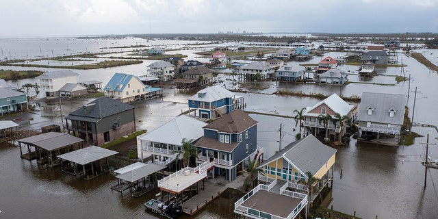 Flood waters still surround homes as residents attempt to recover from the effects of Hurricane Ida on Wednesday, September 1, 2021 in Myrtle Grove, Louisiana.  (Associated press)