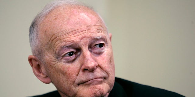 FILE — In this May 16, 2006 file photo former Washington Archbishop, Cardinal Theodore McCarrick pauses during a press conference in Washington. McCarrick is due in court to face charges that he sexually assaulted a 16-year-old boy during a wedding reception in Massachusetts nearly 50 years ago. The 91-year-old McCarrick is scheduled to be arraigned in suburban Boston's Dedham District Court Friday, Sept. 3, more than a month after he was charged. (AP Photo/J. Scott Applewhite, File)