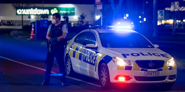 Police stand outside the site of a knife attack at a supermarket in Auckland, New Zealand, Friday, Sept. 3, 2021. (Associated Press)