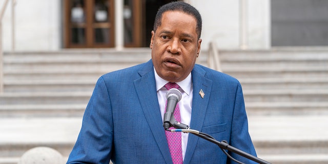 Conservative radio talk show host Larry Elder speaks to supporters during a campaign stop outside the Hall of Justice in downtown Los Angeles Sept.  2, 2021.