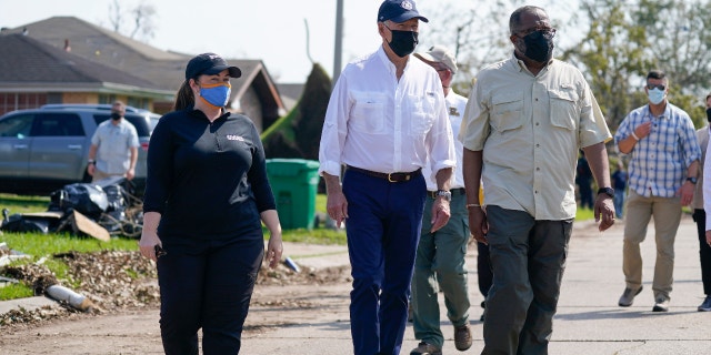 President Joe Biden tours a neighborhood impacted by Hurricane Ida, Friday, Sept. 3, 2021, in LaPlace, La. (AP Photo/Evan Vucci)