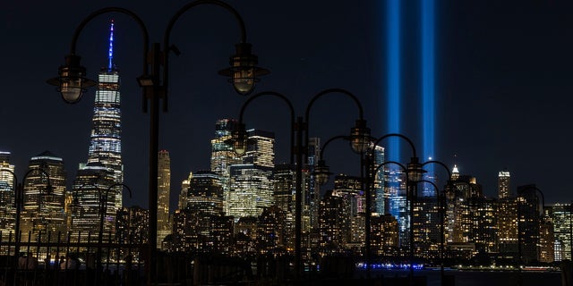 In this Sept. 11, 2020, file photo tribute in Light, two vertical columns of light representing the fallen towers of the World Trade Center shine against the lower Manhattan skyline on the 19th anniversary of the Sept. 11, 2001, terror attacks, seen from Jersey City, N.J. (AP Photo/Stefan Jeremiah, File)