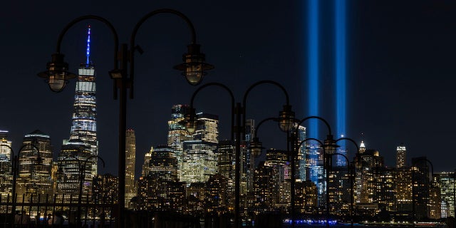 In this Sept. 11, 2020, file photo tribute in Light, two vertical columns of light representing the fallen towers of the World Trade Center shine against the lower Manhattan skyline on the 19th anniversary of the Sept. 11, 2001, terror attacks, seen from Jersey City, N.J. (AP Photo/Stefan Jeremiah, File)