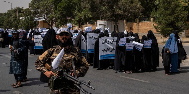 Women march in support of the Taliban government outside Kabul University, Afghanistan, on Saturday, Sept. 11, 2021. 