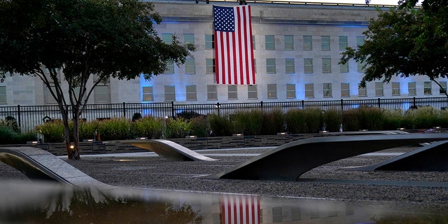 An American flag is unfurled at the Pentagon in Washington, Saturday, Sept. 11, 2021, at sunrise on the morning of the 20th anniversary of the terrorist attacks. (Associated Press)