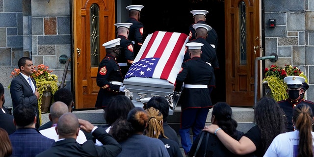 The coffin of Sgt.  Johanny Rosario Pichardo, a U.S. Navy who was among 13 servicemen killed in a suicide bombing in Afghanistan, is transported to Farrah's funeral home in his hometown of Lawrence, Mass, on Saturday, September 11, 2021. 