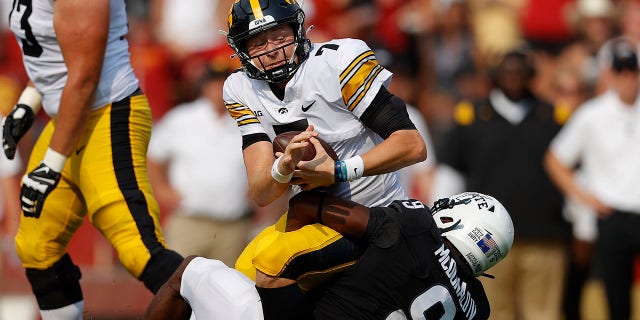 Iowa State defensive end Will McDonald (9) sacks Iowa quarterback Spencer Petras (7) during the first half of an NCAA college football game, Saturday, Sept. 11, 2021, in Ames, Iowa.