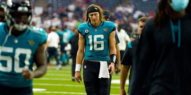 Jacksonville Jaguars quarterback Trevor Lawrence (16) walks off the field after an NFL football game against the Houston Texans Sunday, Sept. 12, 2021, in Houston. The Texans won 37-21.
