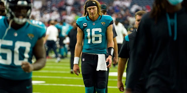 Jacksonville Jaguars quarterback Trevor Lawrence (16) walks off the field after an NFL football game against the Houston Texans Sunday, Sept. 12, 2021, in Houston. The Texans won 37-21.