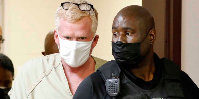 Alex Murdaugh walks into his bond hearing Thursday, Sept. 16, 2021, in Varnville, S.C. Murdaugh surrendered Thursday to face insurance fraud and other charges after state police said he arranged to have himself shot in the head so that his son would get a $10 million life insurance payout.
