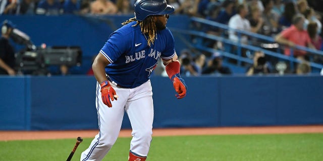 Toronto Blue Jay Vladimir Guerrero Jr. watches his solo home run against the Minnesota Twins during the third inning on Friday, Sept. 17, 2021, in Toronto. (Jon Blacker/The Canadian Press via AP)