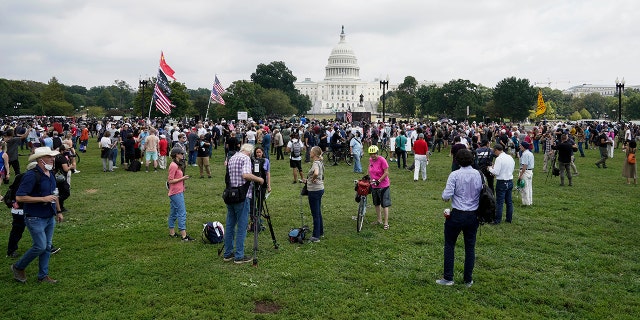 People attend a rally near the U.S. Capitol in Washington, Saturday, Sept. 18, 2021.