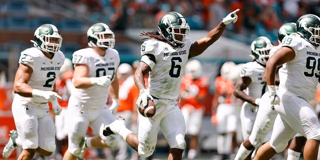 Michigan State linebacker Quavaris Crouch (6) celebrates after recovering a fumble during the first quarter of an NCAA college football game against Miami, Saturday, Sept. 18, 2021, in Miami Gardens, Fla. 
