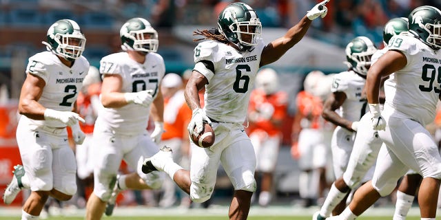 Michigan State linebacker Quavaris Crouch (6) celebrates after recovering a fumble during the first quarter of an NCAA college football game against Miami, Saturday, Sept. 18, 2021, in Miami Gardens, Fla. 