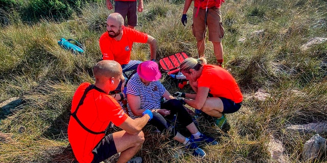 This photo provided by the Croatian Mountain Rescue Service, shows the rescue operation of an unidentified woman who was found on the Adriatic island of Krk on Sept. 12, 2021.  (Croatian Mountain Rescue Service via AP)