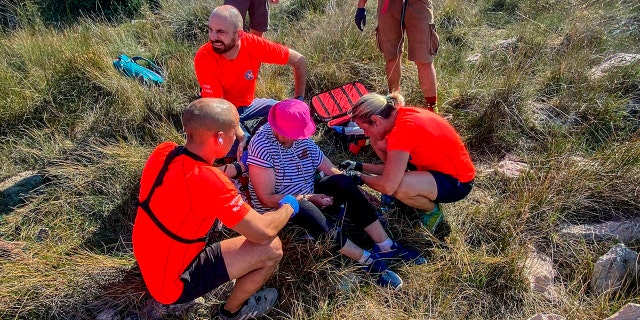 This photo provided by the Croatian Mountain Rescue Service, shows the rescue operation of an unidentified woman who was found on the Adriatic island of Krk on Sept. 12, 2021.  (Croatian Mountain Rescue Service via AP)