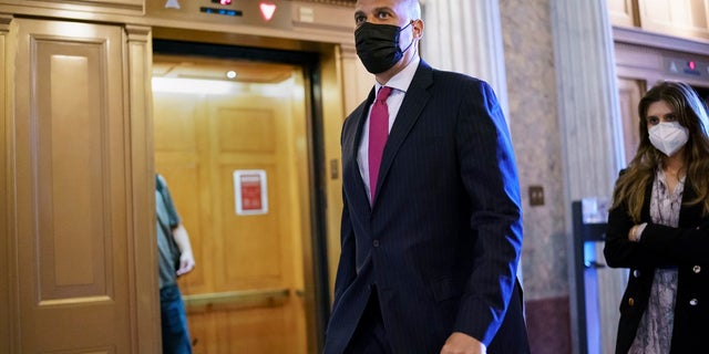 Sen.  Cory Booker, DN.J., arrives at the Senate Chamber in the Capitol in Washington on Wednesday after two congressional talks on revamping policing practices ended without agreement.  (AP Photo / J. Scott Applewhite)