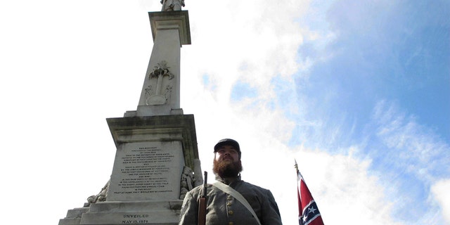 FILE - In this July 10, 2017, file photo, Cameron Maynard comes to the attention of the monument to the Confederate soldiers in the state of Carolina in the state of Carolina, SC.  vote from the General Assembly.  (AP Photo / Jeffrey Collins, file)