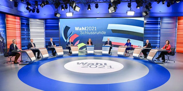 Candidates for the upcoming German election attend a final televised debate in Berlin, Thursday Sept. 23, 2021, ahead of the election on Sunday. From left to 4th left, Alice Weidel, co-leader of the Alternative for Germany party (AfD); Christian Lindner, leader of the Free Democratic Party (FDP); Markus Soeder, Christian Social Union party leader and Bavarian Prime Minister, and Armin Laschet, chairman of the German Christian Democratic Union. From 3rd right to right, Annalena Baerbock, Green Party co-leader; Olaf Scholz, Finance Minister and SPD candidate, and Janine Wissler, co-leader of the left party Die Linke. (Tobias Schwarz/Pool via AP)