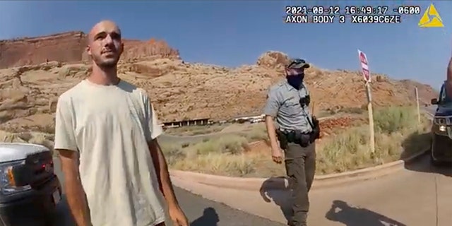 FILE - This Aug. 12, 2021 file photo from video provided by The Moab Police Department shows Brian Laundrie talking to a police officer after police pulled over the van he was traveling in with his girlfriend, Gabrielle "Gabby" Petito, near the entrance to Arches National Park. (The Moab Police Department via AP, File)