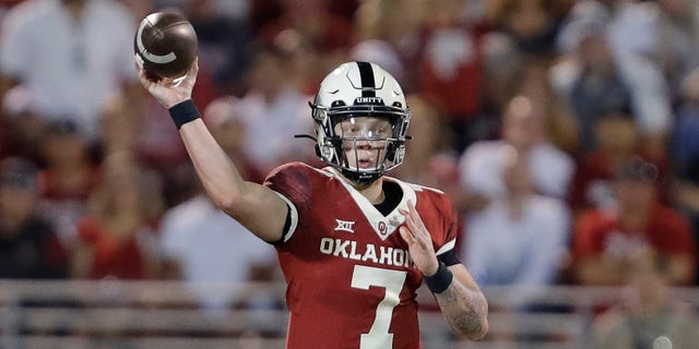 Oklahoma quarterback Spencer Rattler (7) passes against West Virginia during the second half of an NCAA college football game in Norman, Okla., Saturday, Sept. 25, 2021. (AP Photo/Alonzo Adams)