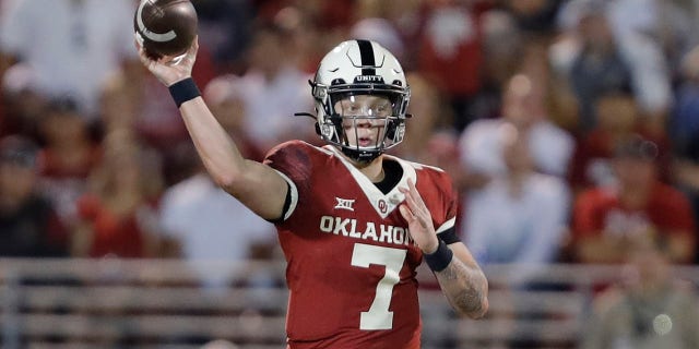 Oklahoma quarterback Spencer Rattler (7) passes against West Virginia during the second half of an NCAA college football game in Norman, Okla., Saturday, Sept. 25, 2021. (AP Photo/Alonzo Adams)