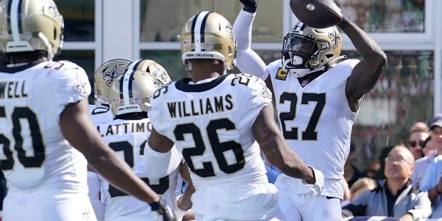 New Orleans Saints strong safety Malcolm Jenkins (27) celebrates after his touchdown against the New England Patriots during the second half of a game, Sunday, Sept. 26, 2021, in Foxborough, Mass.