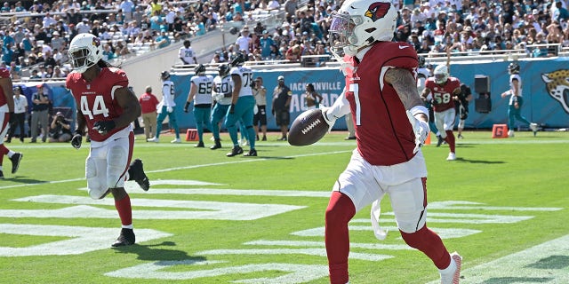 Arizona Cardinals cornerback Byron Murphy (7) celebrates his touchdown against the Jacksonville Jaguars on an intercepted pass during the second half of an NFL football game, Sunday, Sept. 26, 2021, in Jacksonville, Fla. (AP Photo/Phelan M. Ebenhack)