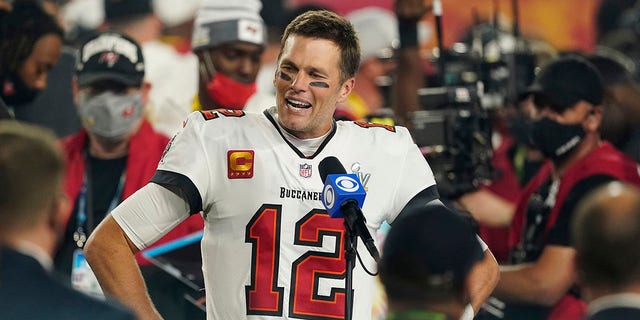 Tampa Bay Buccaneers quarterback Tom Brady is interviewed on the field after the 2021 Super Bowl game with the Kansas City Chiefs in Tampa, Fla. On February 7, 2021.
