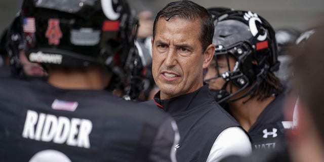 TravelGuides - Cincinnati’s Luke Fickell expected to be in mix for NFL gigs 2 FILE - Cincinnati head coach Luke Fickell speaks with quarterback Desmond Ridder (9) prior to an NCAA college football game against Miami (Ohio) in Cincinnati, in this Saturday, Sept. 4, 2021, file photo.