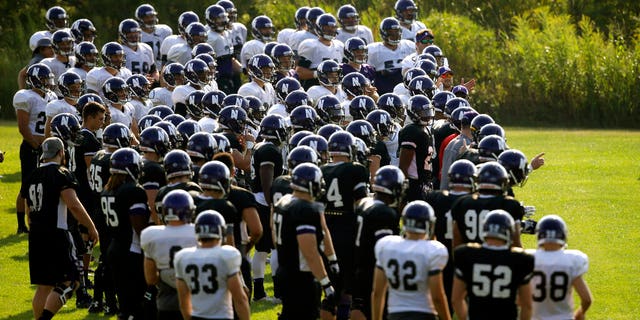 FILE: Northwestern football players gather during practice at the University of Wisconsin-Parkside campus in Kenosha, Wisc., in this Monday, Aug. 17, 2015, file photo.