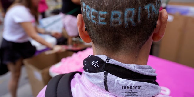 Britney Spears supporter Kim Van Doorn of Bakersfield, Calif., shows off a "Free Britney" design in her hair outside the Stanley Mosk Courthouse, Wednesday, Sept. 29, 2021, in Los Angeles.  (AP Photo/Chris Pizzello)