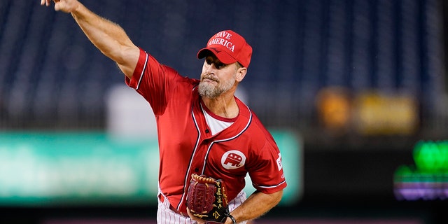 Rep. Greg Steube, R-Fla., pitches during the first inning of the Congressional baseball game at Nationals Park Wednesday, Sept. 29, 2021, in Washington. (AP Photo/Alex Brandon)