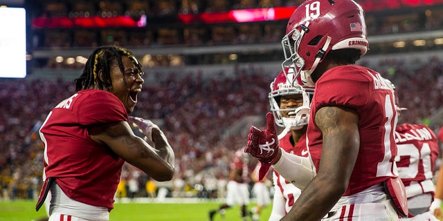 Alabama wide receiver Jameson Williams (1) celebrates with tight end Jahleel Billingsley (19) after Billingsley's touchdown against Southern Miss in the first half of an NCAA college football game on Saturday 25 September 2021, in Tuscaloosa, Ala.