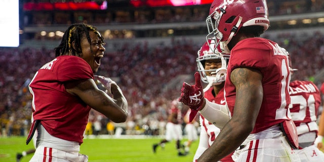 Alabama wide receiver Jameson Williams (1) celebrates with tight end Jahleel Billingsley (19) after Billingsley's touchdown against Southern Miss in the first half of an NCAA college football game on Saturday 25 September 2021, in Tuscaloosa, Ala.