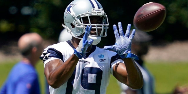 Dallas Cowboys wide receiver Amari Cooper reaches out to catch a pass during a workout at the team's NFL football training facility in Frisco, Texas, Wednesday, Aug. 25, 2021. (AP Photo/Tony Gutierrez)