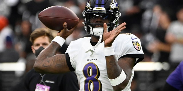 Baltimore Ravens quarterback Lamar Jackson (8) warms up before an NFL football game against the Las Vegas Raiders, Monday, Sept. 13, 2021, in Las Vegas. (AP Photo/David Becker)