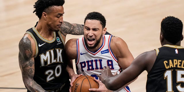 Ben Simmons ( 25 ) drives to the basket against Atlanta Hawks forward John Collins ( 20 ) during the first half in game six in the second round of the 2021 NBA Playoffs at State Farm Arena in Atlanta.