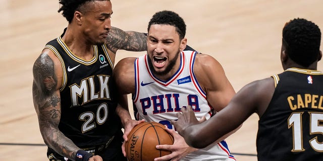 Ben Simmons (25) drives to the basket against Atlanta Hawks forward John Collins (20) during the first half in game six in the second round of the 2021 NBA Playoffs at State Farm Arena in Atlanta.