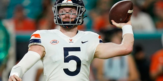 Virginia Cavaliers quarterback Brennan Armstrong (5) aims a pass during the first half of a NCAA college football game against the Miami Hurricanes, Thursday, Sept. 30, 2021, in Miami Gardens, Fla.