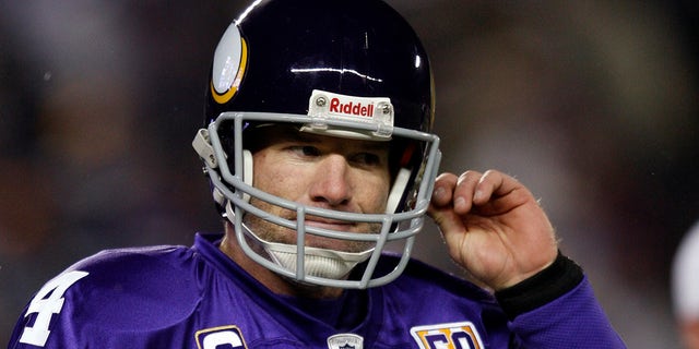 Minnesota Vikings quarterback Brett Favre goes to the sidelines after throwing an intercepted pass by Chicago Bears Julius Peppers during the first quarter of their NFL football game at TCF Bank Stadium in Minneapolis on December 20, 2010. 